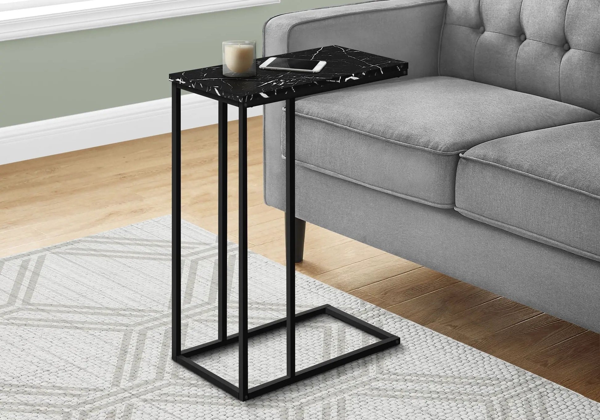 C-shaped accent table sofa-side with black marble-look top and slender black metal frame on Tampa Home & Garden Store