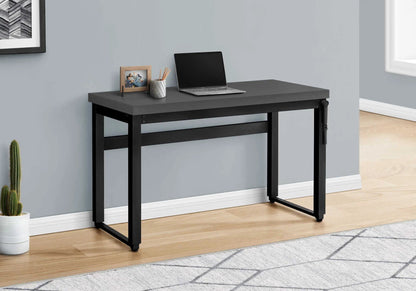 Computer desk with gray top and black metal frame, laptop, framed photo, pencil cup on Tampa Home & Garden Store