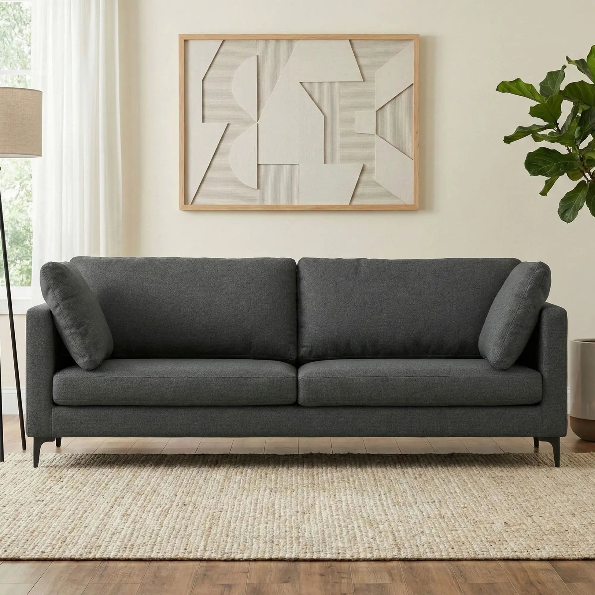 Ava Mid Century Sofa upholstered in dark gray fabric with slim metal legs, two-seat unit on Tampa Home & Garden Store