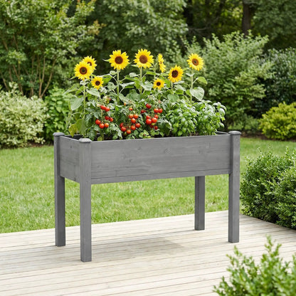 Elevated raised garden bed planter in gray wood with sunflowers and tomatoes on Tampa Home & Garden Store