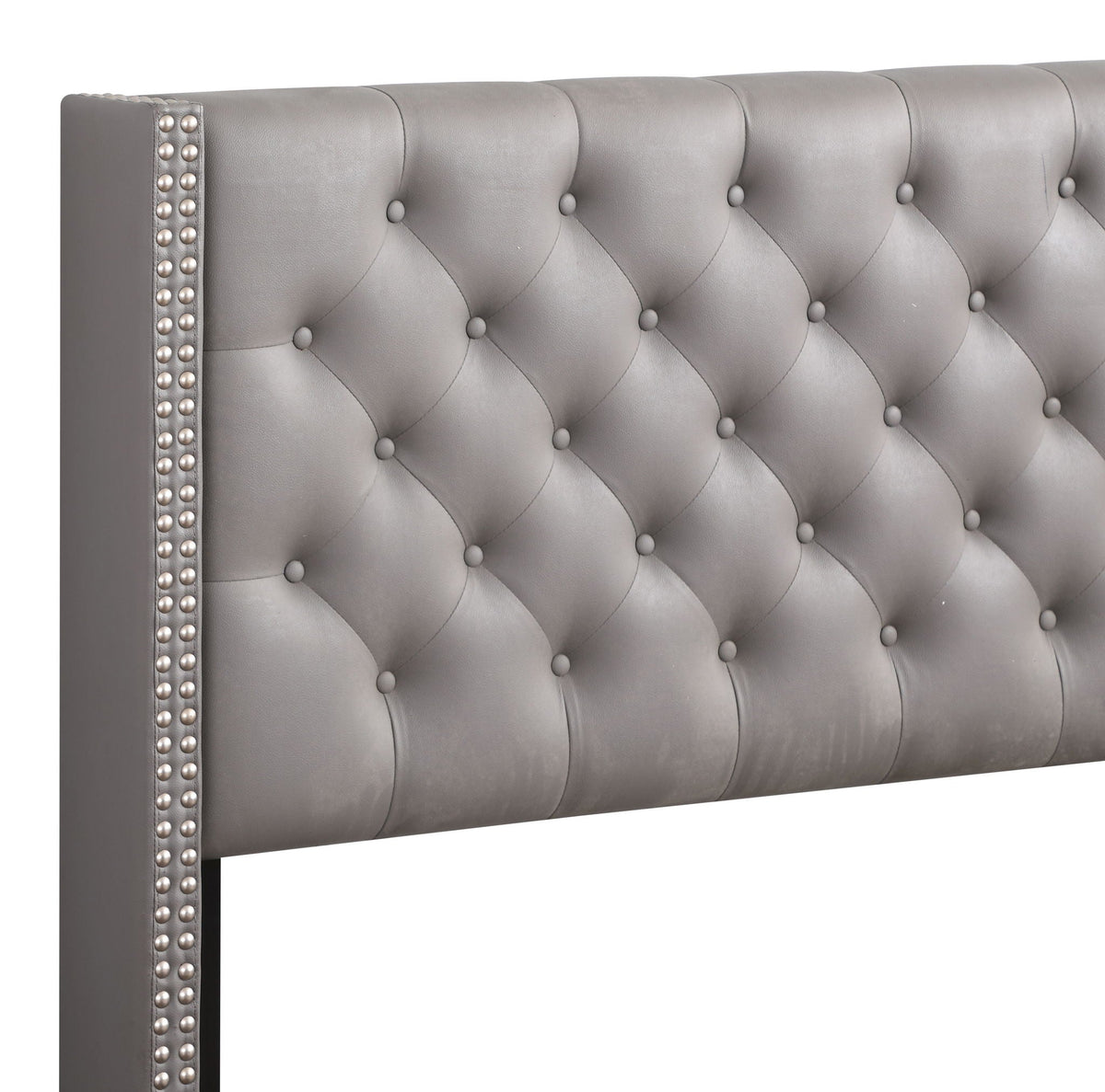 Nailhead Bed Vibrant gray tufted upholstered bed with stud trim on Tampa Home & Garden Store