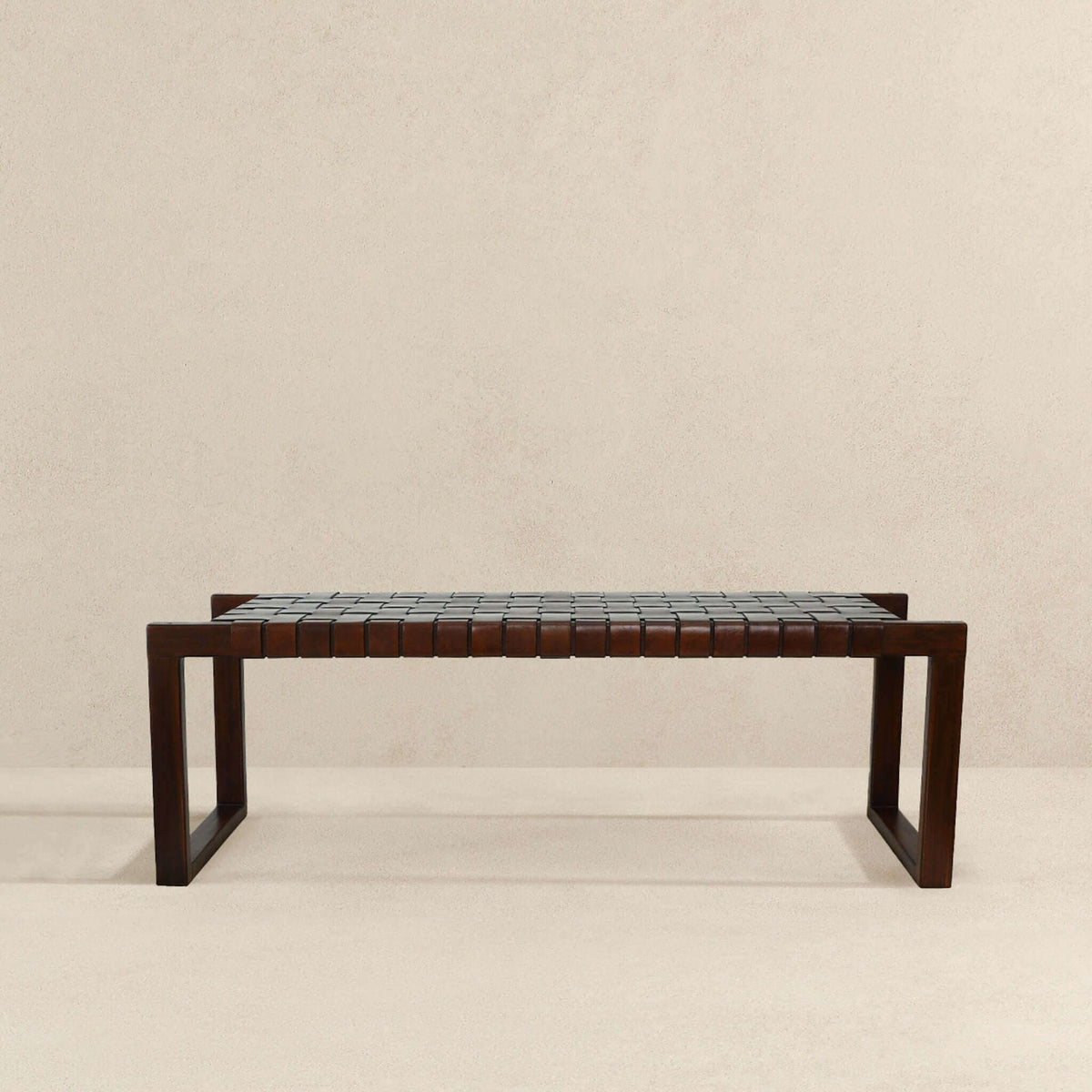 Cognac brown upholstered bench with leather tile seat in mid-century modern wood frame on Tampa Home & Garden Store
