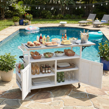 Foldable outdoor kitchen island cart in white wood with storage shelves and wheels on Tampa Home & Garden Store