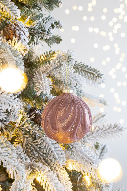 Decorative hanging glass Christmas ball ornament in mauve with gold glitter on frosted tree on Tampa Home & Garden Store