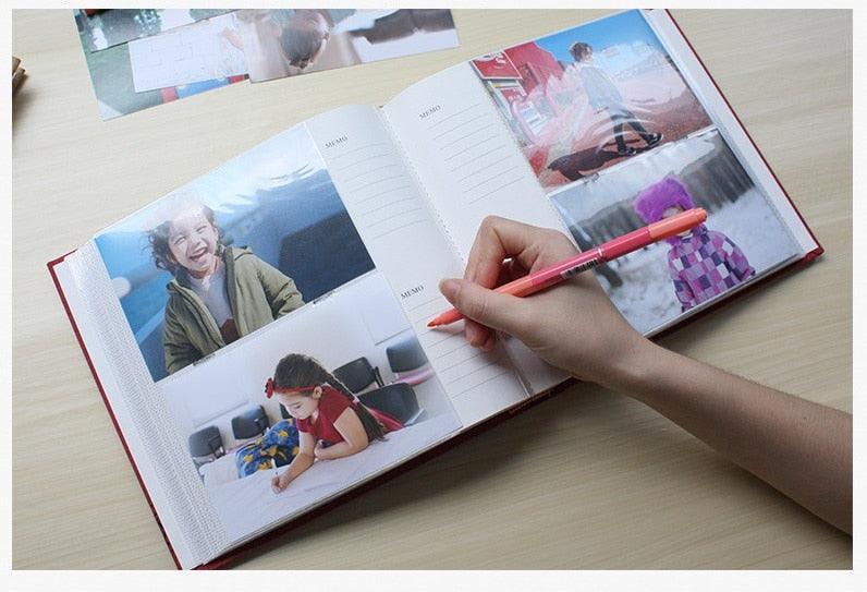 Stevvex 6-inch Intert Photo Album with 200 pages open to photos, hand writing with pink pen on Tampa Home & Garden Store
