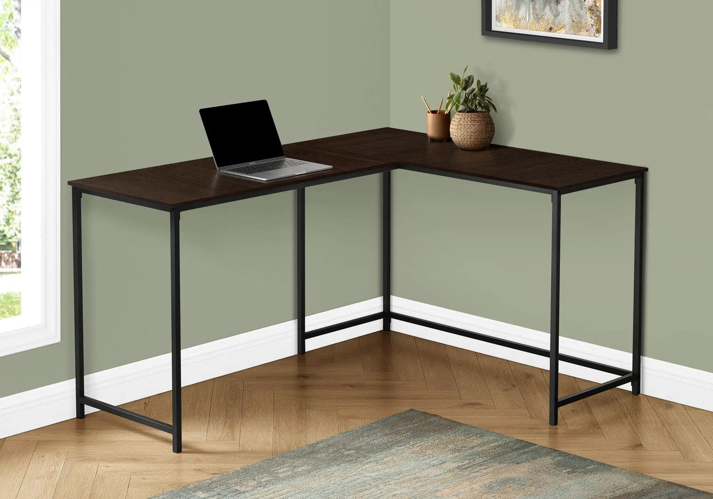 L-shaped desk with dark wood top and black metal legs; laptop left, plants right in a corner setup on Tampa Home & Garden Store