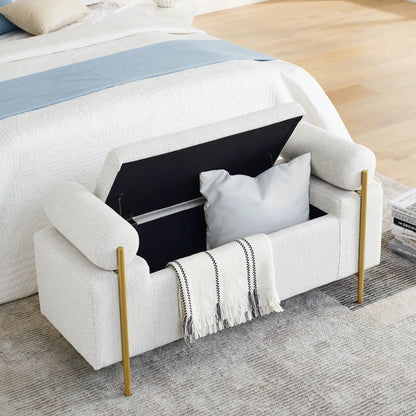 Elegant upholstered storage bench with light gray fabric, cylindrical arms and gold legs on Tampa Home & Garden Store