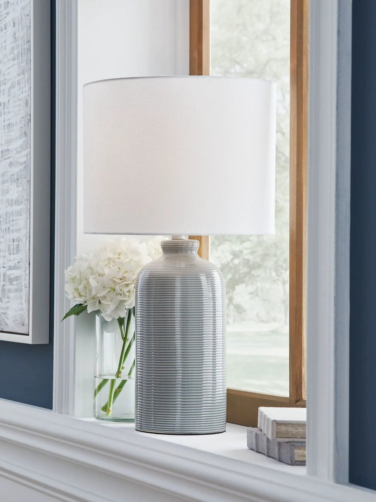 Wimlow ceramic table lamp gray-blue with ribbed base and white shade on windowsill on Tampa Home & Garden Store