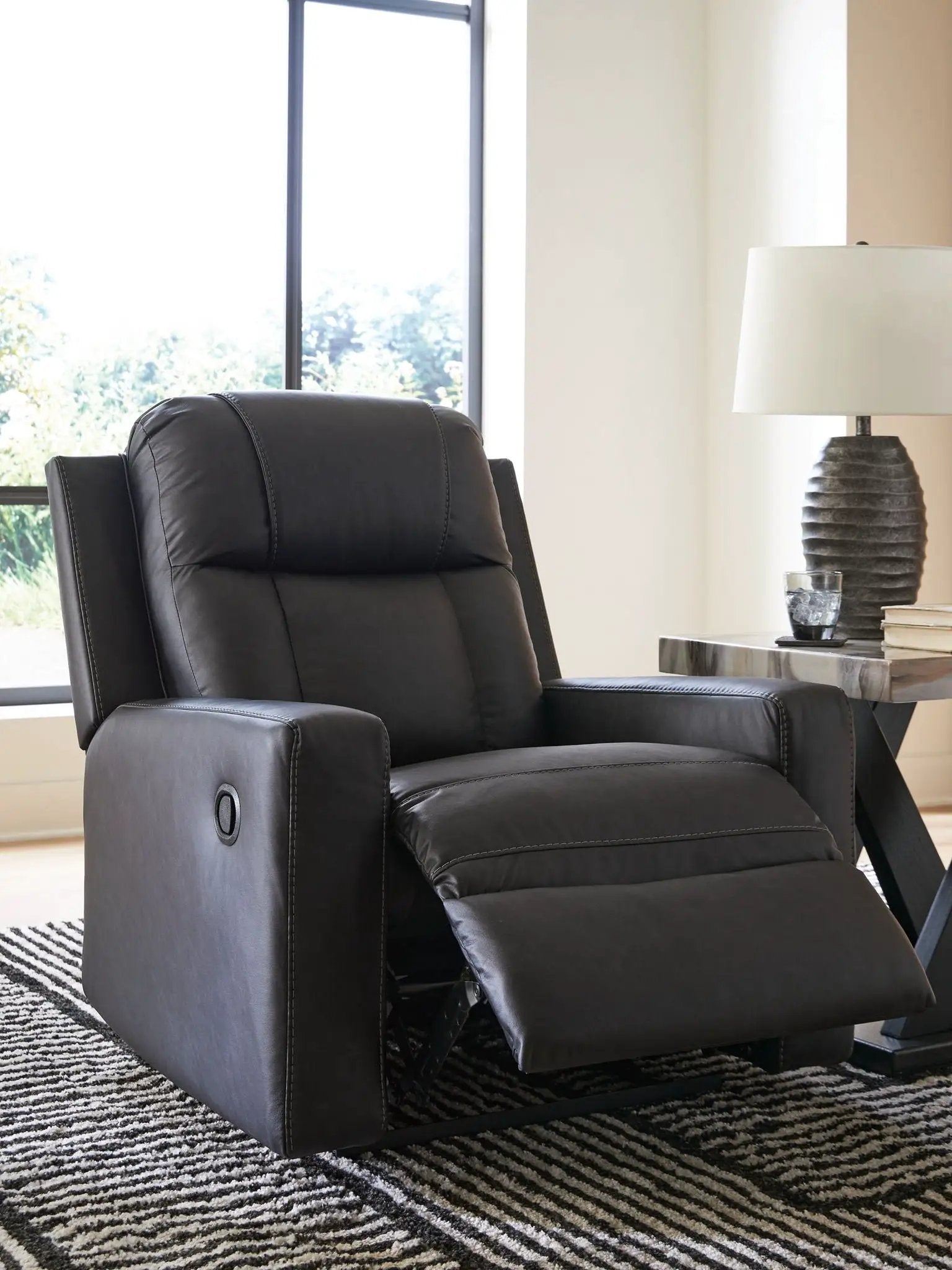 Mackmenville Zero Wall Recliner in black leather with padded headrest and extended footrest on Tampa Home & Garden Store