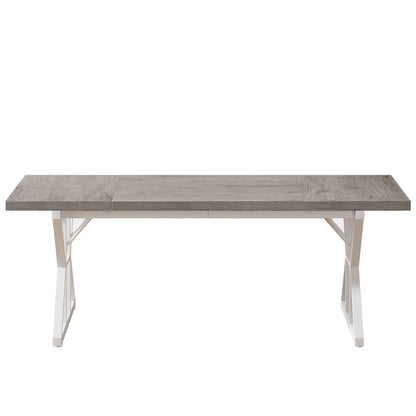 Rectangular dining table with grey wood-grain top and white X-trestle metal legs on Tampa Home & Garden Store