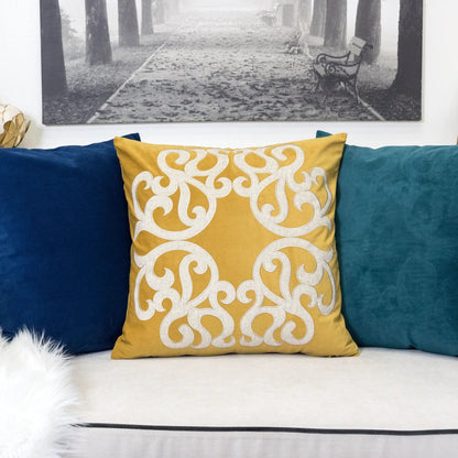 Dora pillow cover with matching back, yellow gold with scroll pattern, pillow on teal sofa on Tampa Home & Garden Store