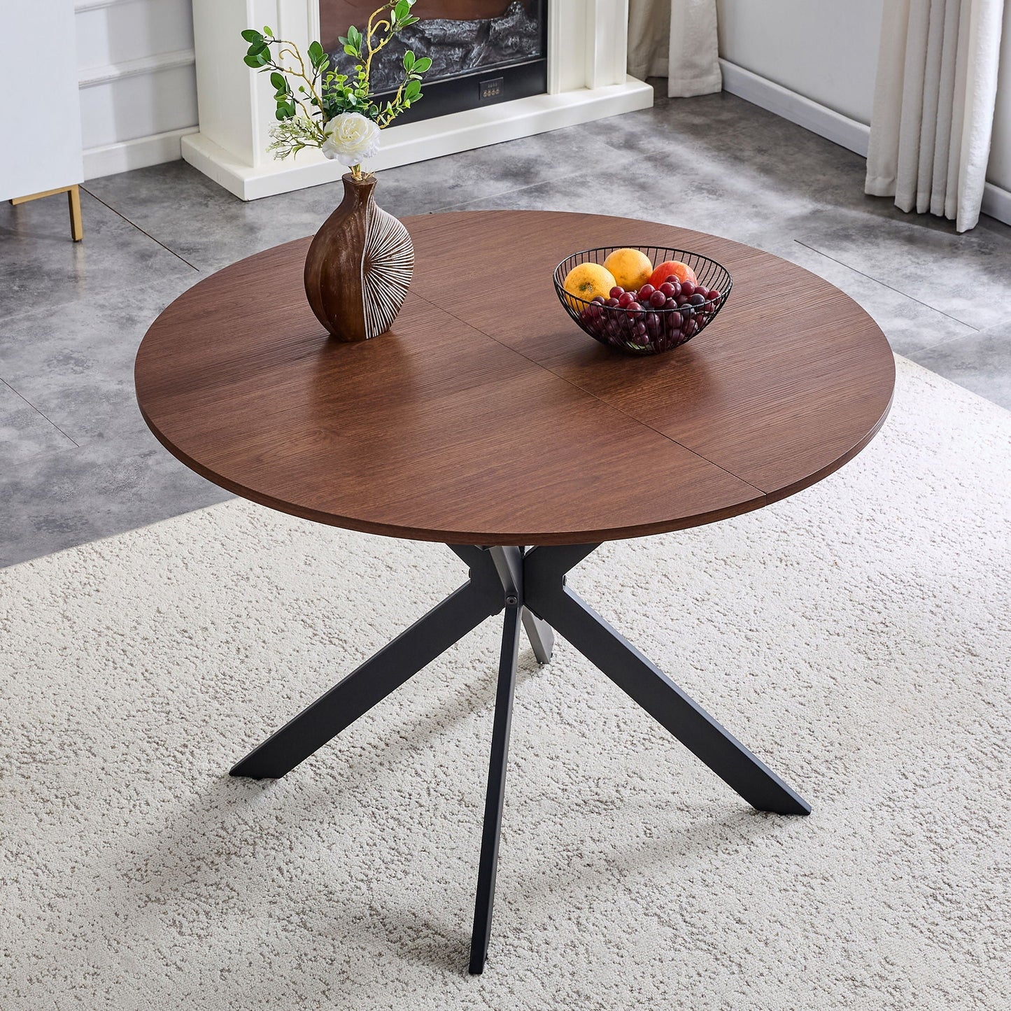 Extendable walnut round dining table by HouseOfZazla with black metal base on Tampa Home & Garden Store