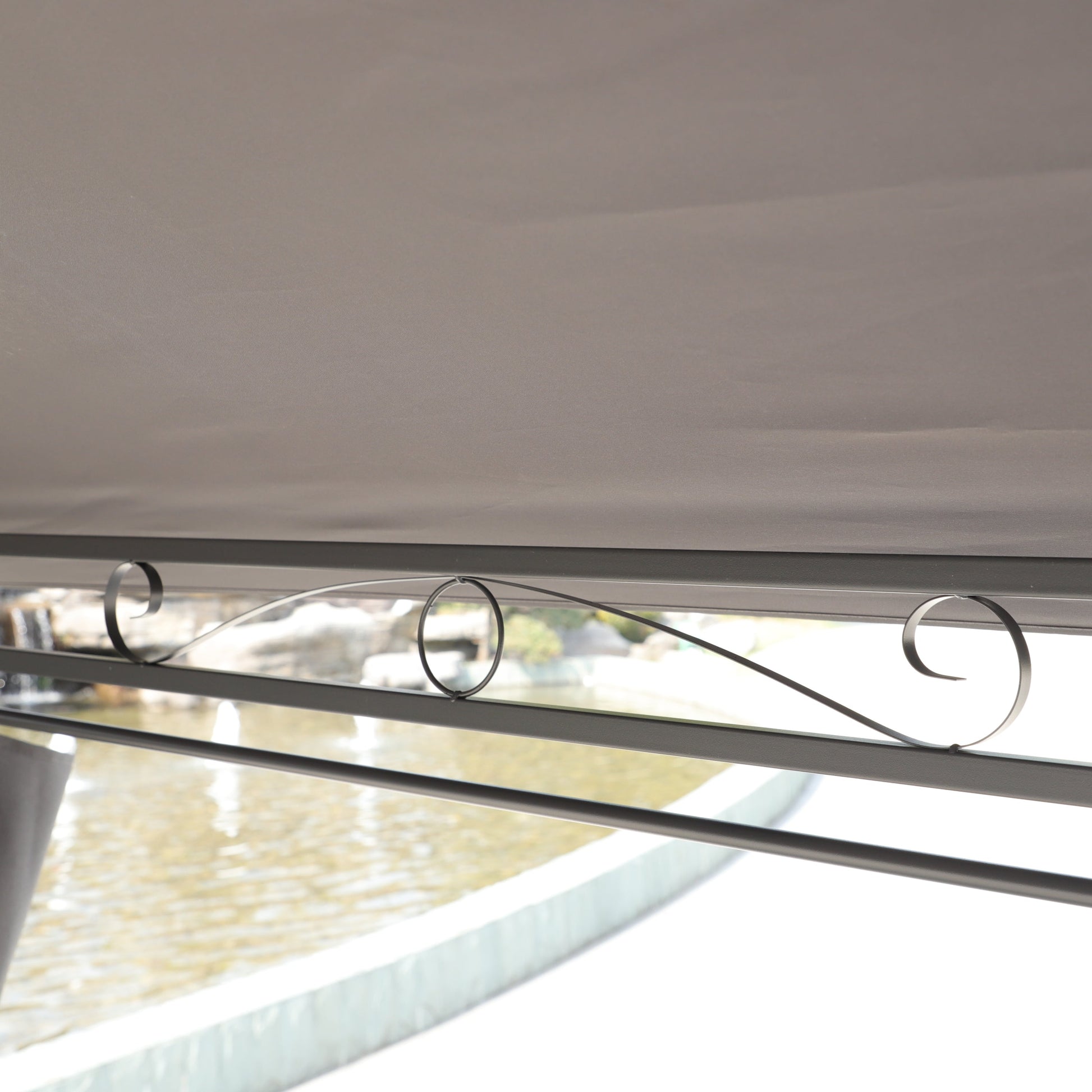 Gazebo canopy interior in grey fabric with circular black metal rings along the frame on Tampa Home & Garden Store
