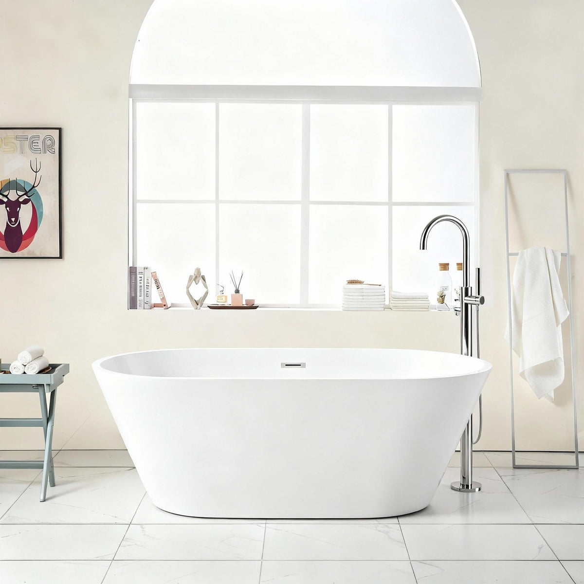 Freestanding glossy white bathtub with drain, chrome floor faucet in bright bath backdrop on Tampa Home & Garden Store