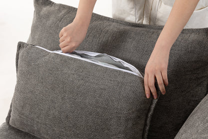 HouseOfZazla modular sectional sofa in gray textured fabric with a zippered edge being opened on Tampa Home & Garden Store