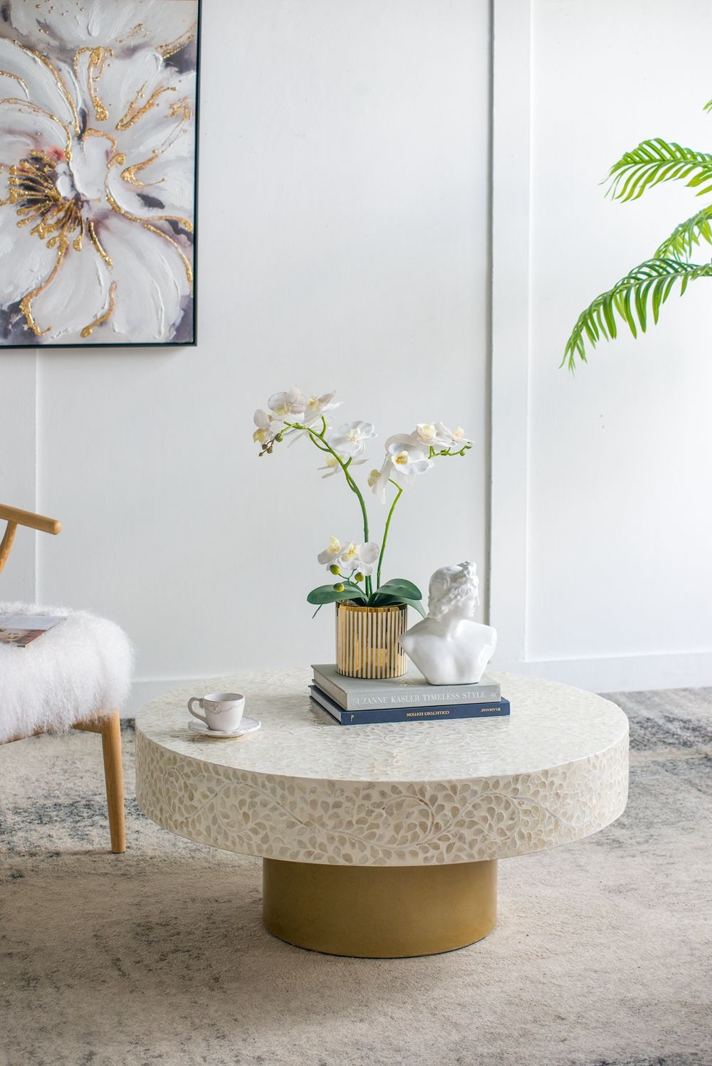 Capiz coffee table with pedestal base; round white capiz top, brass pedestal in living room on Tampa Home & Garden Store