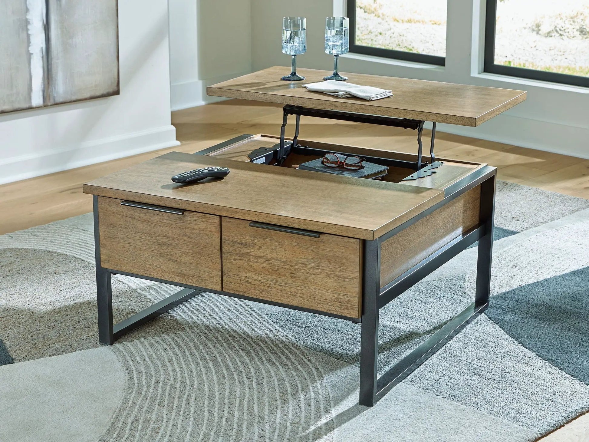 Montia Table lift-top cocktail table in wood with metal base; two blue goblets on Tampa Home & Garden Store