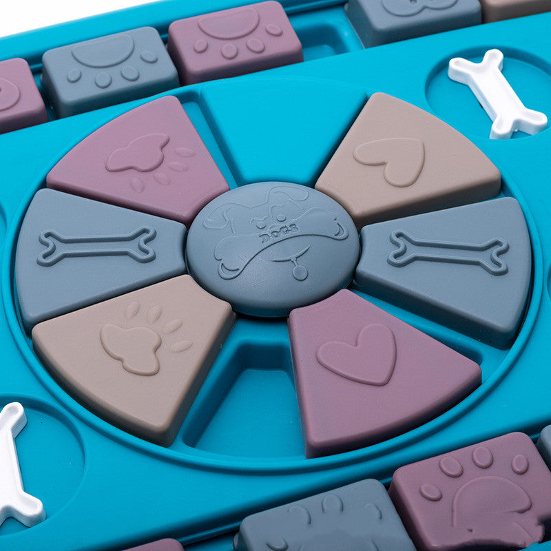 Interactive dog puzzle toy with eight wedges on a blue base featuring paw prints and bone shapes on Tampa Home & Garden Store