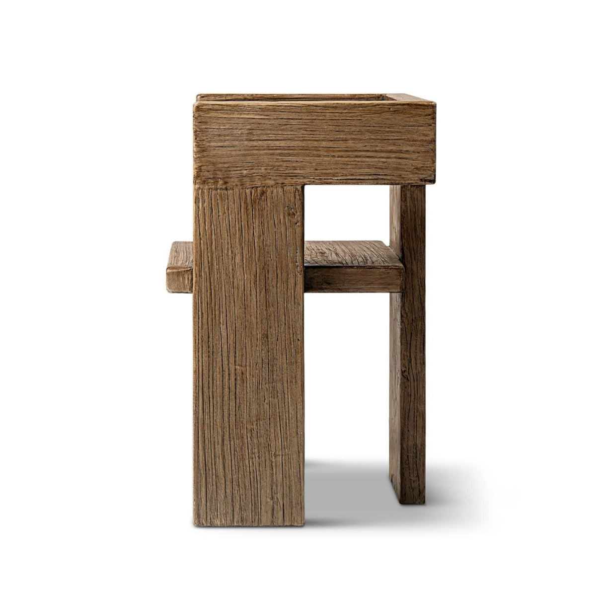 Sculptural block arm chair in reclaimed elm with a brown finish and chunky square legs on Tampa Home & Garden Store