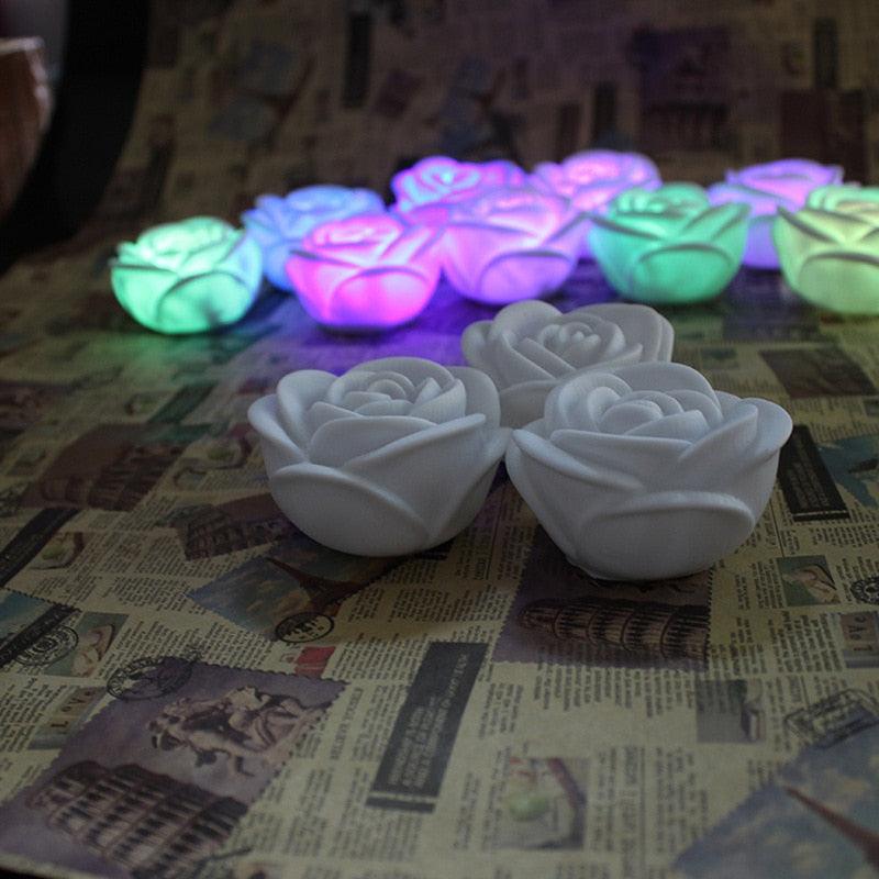Stevvex LED rose candles, white flameless rose lights; three foreground with colorful roses on Tampa Home & Garden Store