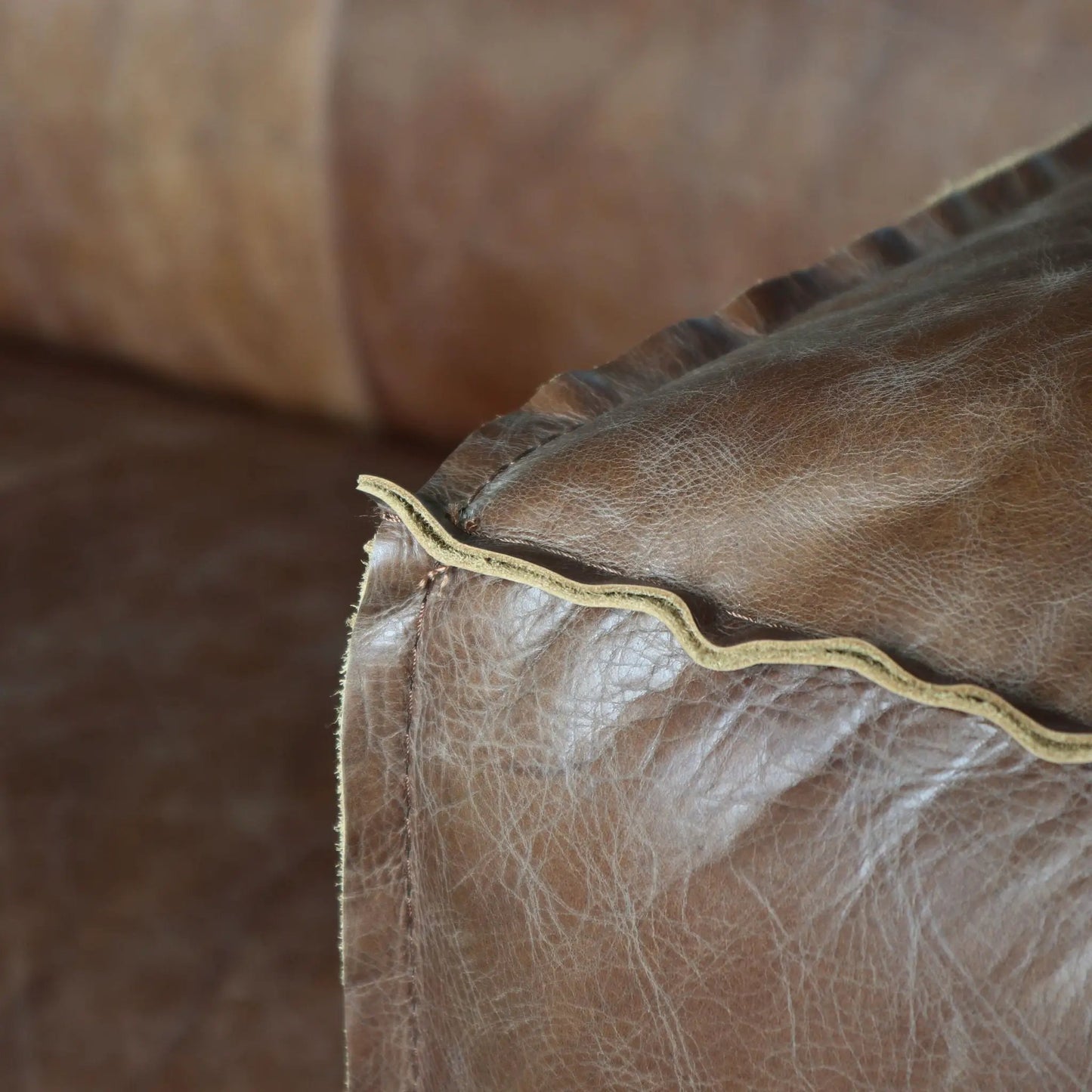 Brancaster grain leather sofa brown close-up texture with visible stitching on Tampa Home & Garden Store