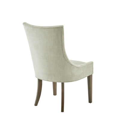 Beige upholstered dining side chair with curved back and dark wood legs on Tampa Home & Garden Store