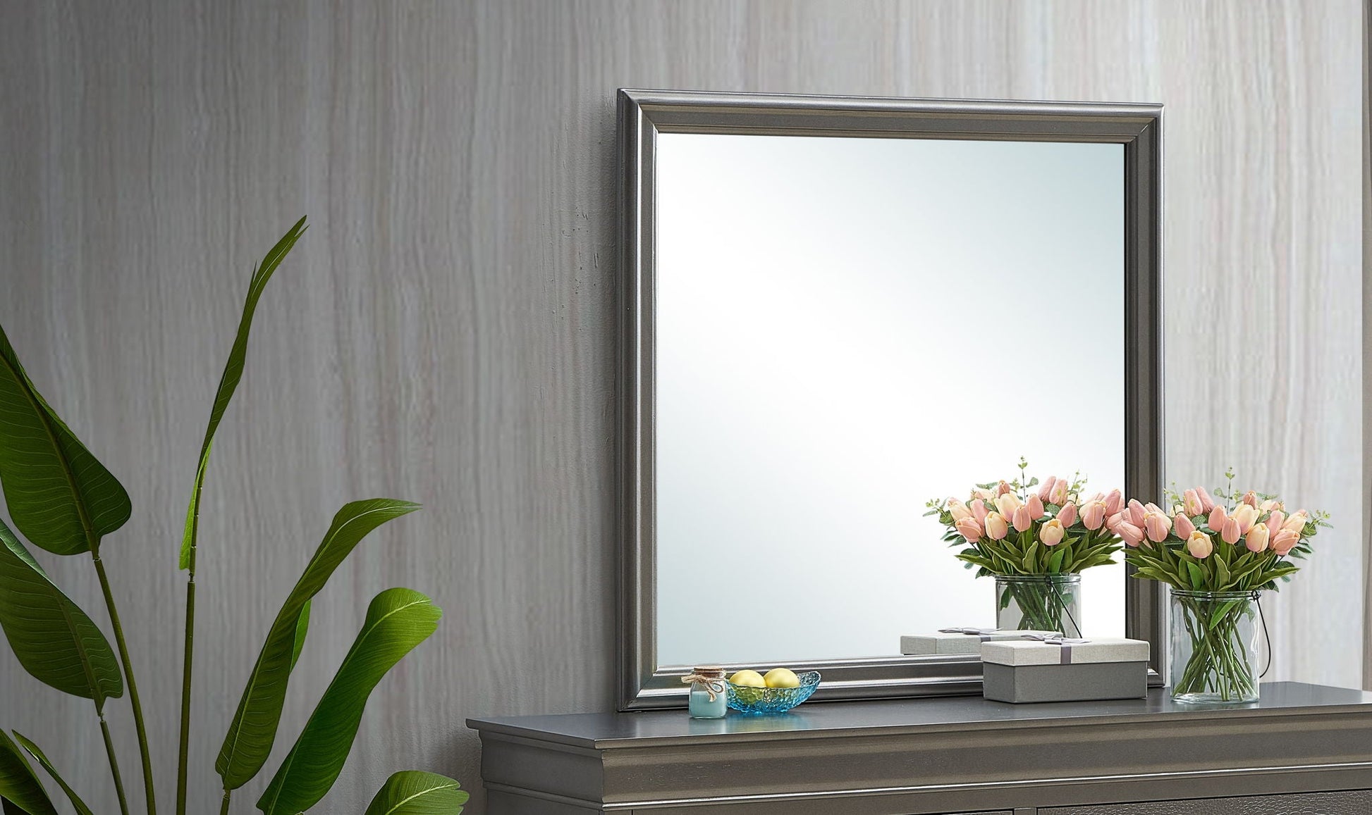 Traditional wall mirror with wood veneer frame on gray console table on Tampa Home & Garden Store