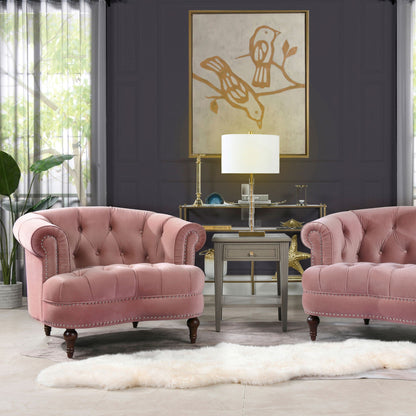 Pair of pink velvet Victorian tufted accent chairs with nailhead trim on dark wood legs on Tampa Home & Garden Store