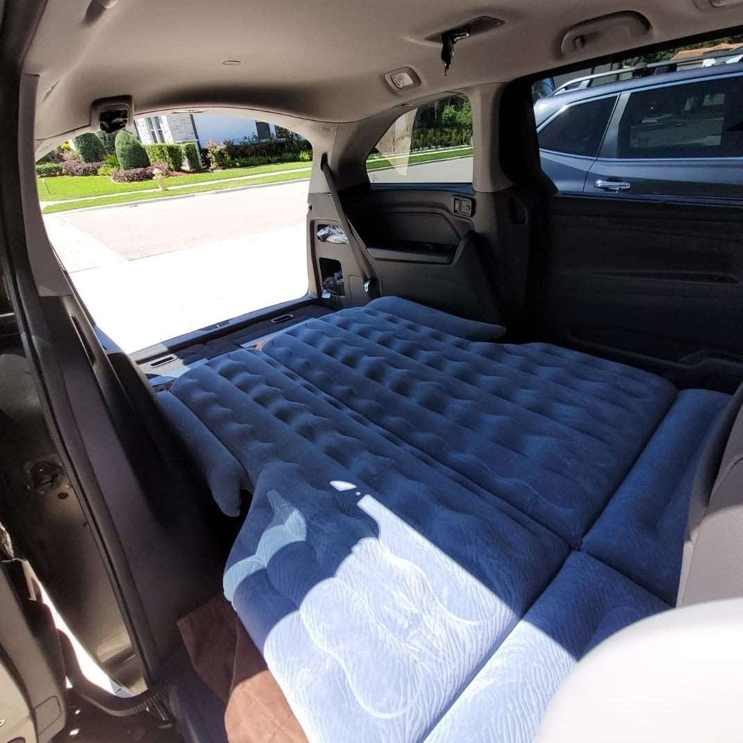 Umbrauto SUV air mattress 1.0 gray spread across back of SUV cargo area with quilted surface on Tampa Home & Garden Store