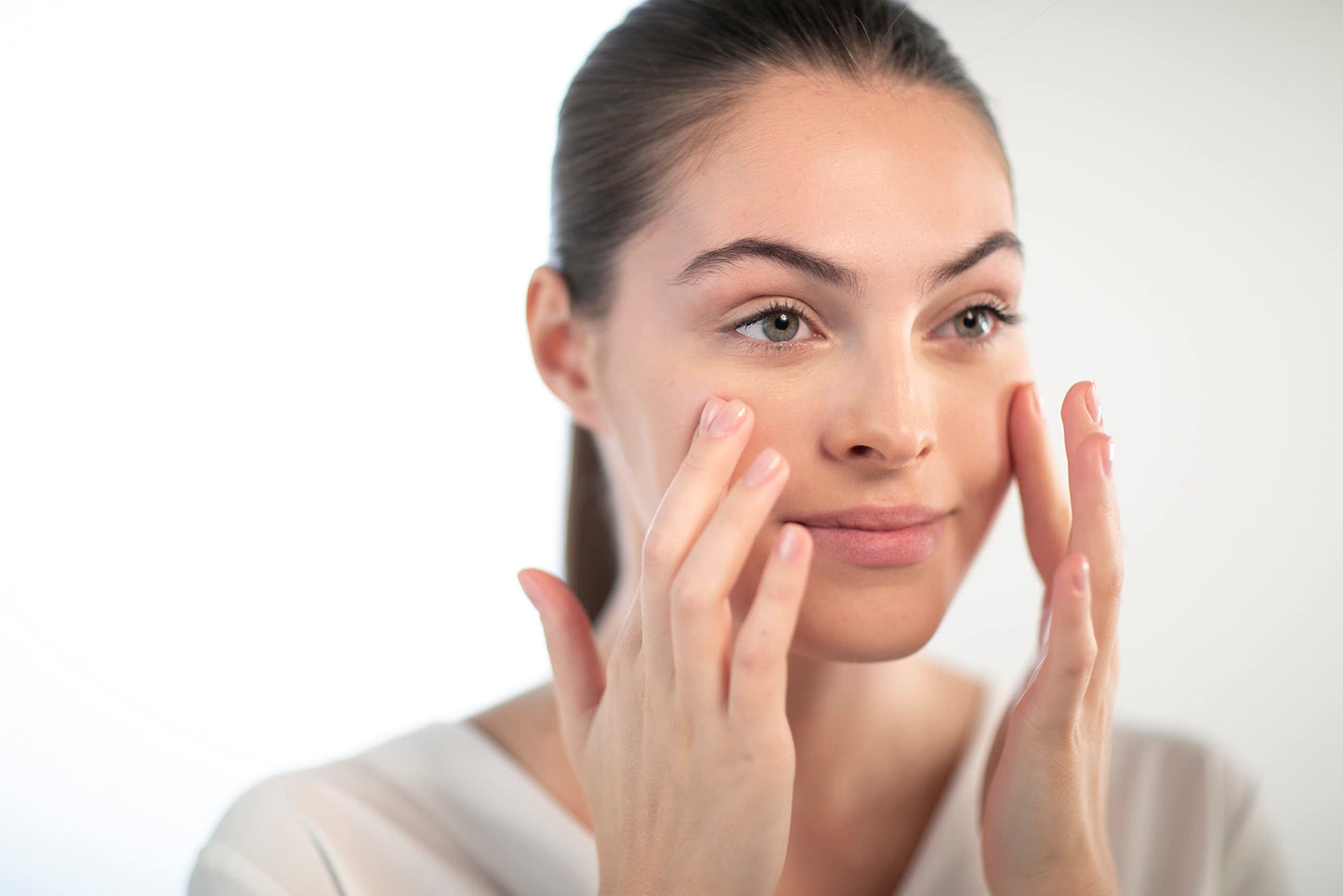 Esthederm Lift & Repair Instant Repulp Mask applied to the face by a woman during skincare on Tampa Home & Garden Store