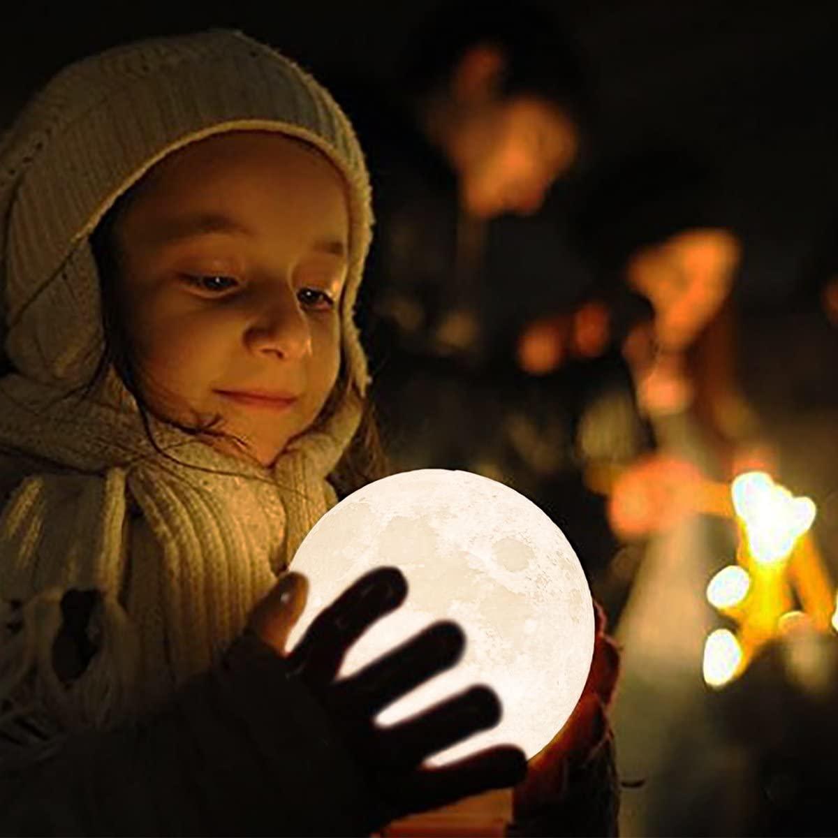 Moon lamp globe held by child in hooded coat, warm light Stevvex 3D-printed night light on Tampa Home & Garden Store