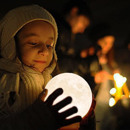 Moon lamp globe held by child in hooded coat, warm light Stevvex 3D-printed night light on Tampa Home & Garden Store
