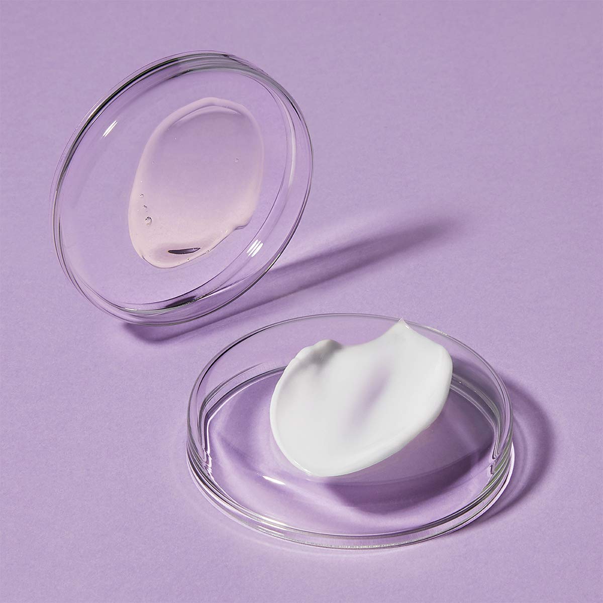 Intensive retinol face cream in glass bowls: pink gel and white cream on lavender backdrop on Tampa Home & Garden Store