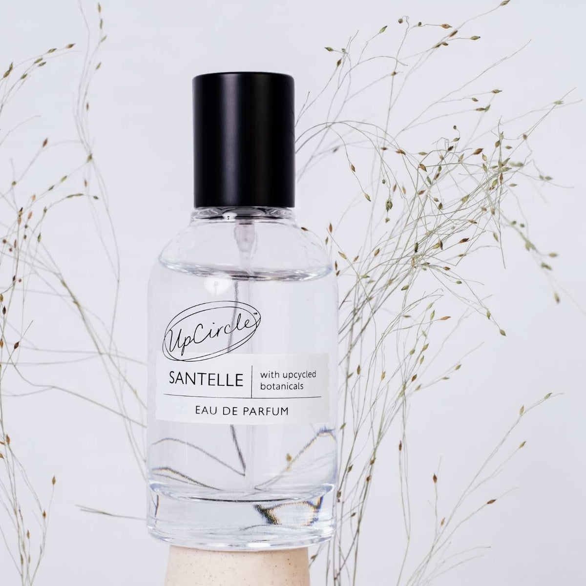 Santelle Eau De Parfum by UpCircle, bottle with black cap, label with upcycled botanicals on Tampa Home & Garden Store