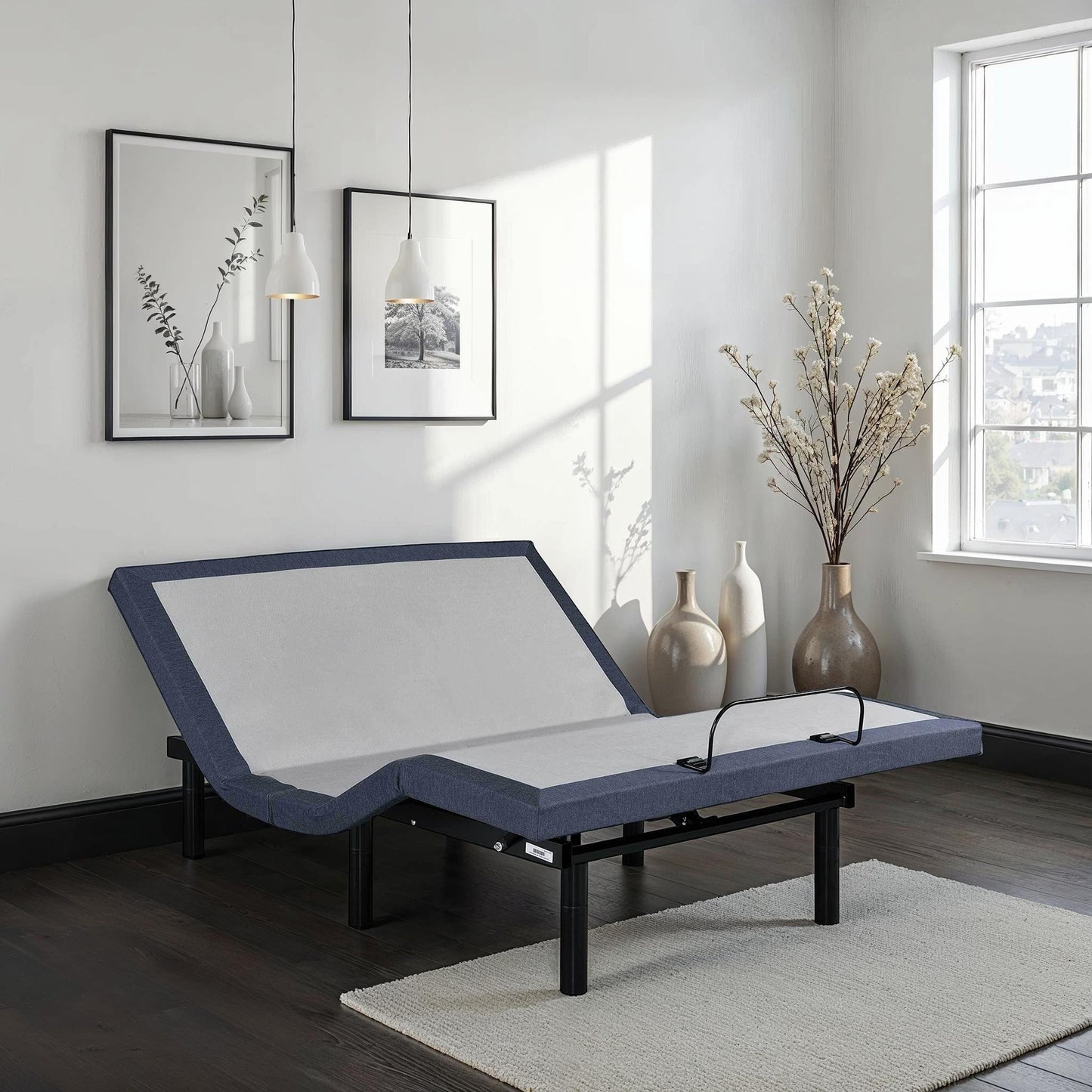 Queen adjustable bed base with black frame and gray mattress with blue edge on Tampa Home & Garden Store