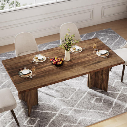 Dining table for 4–6 with thick top, beige upholstered chairs, plates and glasses, vase on Tampa Home & Garden Store