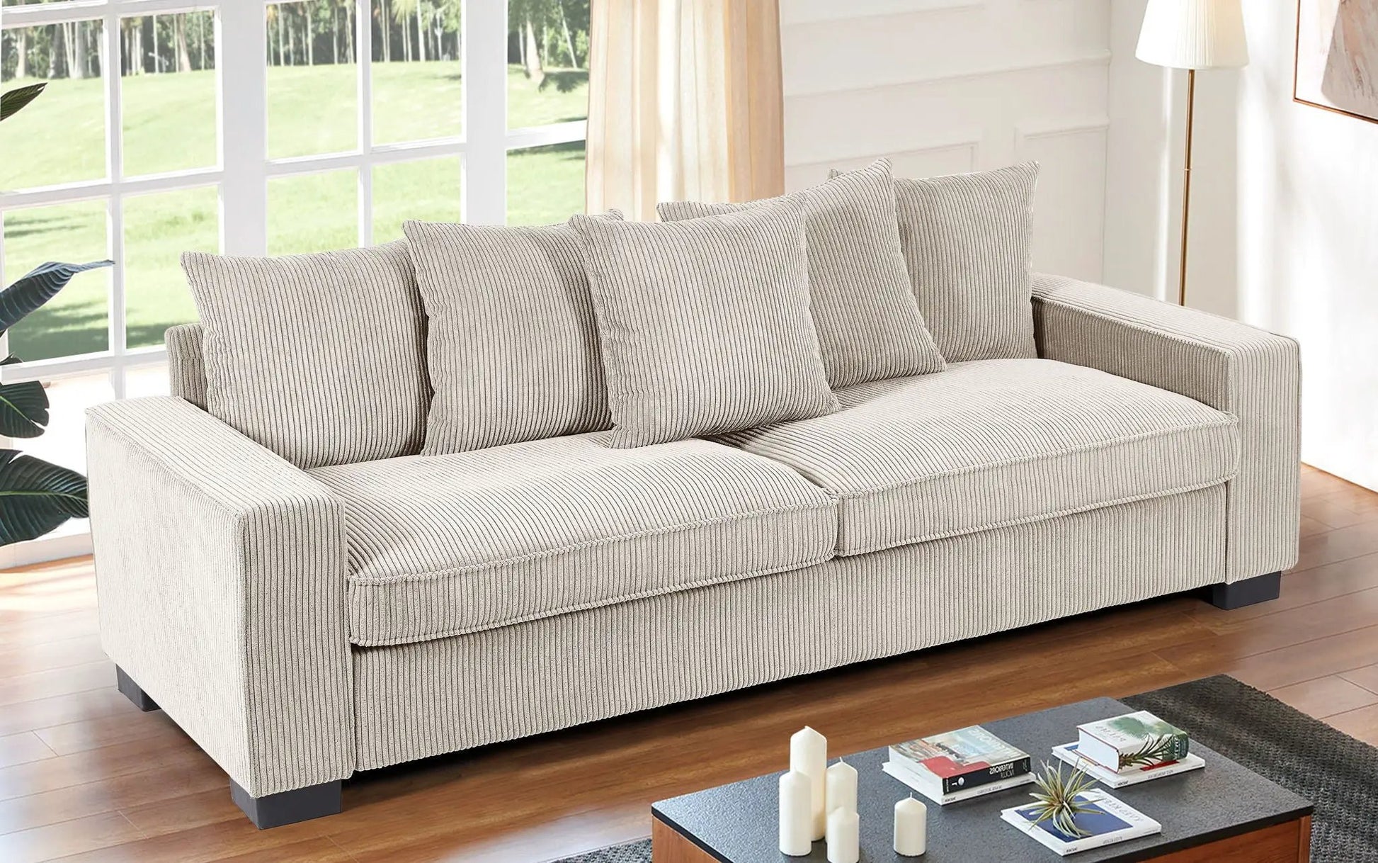 Luxe 3-seat sofa with 5 beige corduroy toss pillows on Tampa Home & Garden Store