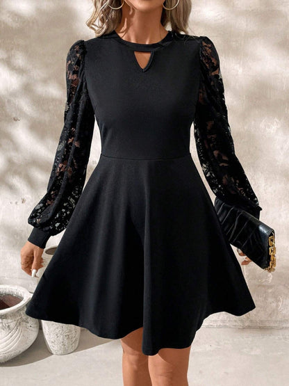 Luxury black long sleeve mini dress by Stevvex with lace puff sleeves and keyhole neckline on Tampa Home & Garden Store