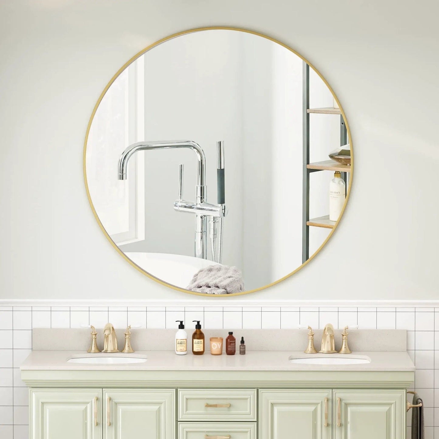 Round wall mirror with a gold metal frame for bathroom or dressing area on Tampa Home & Garden Store