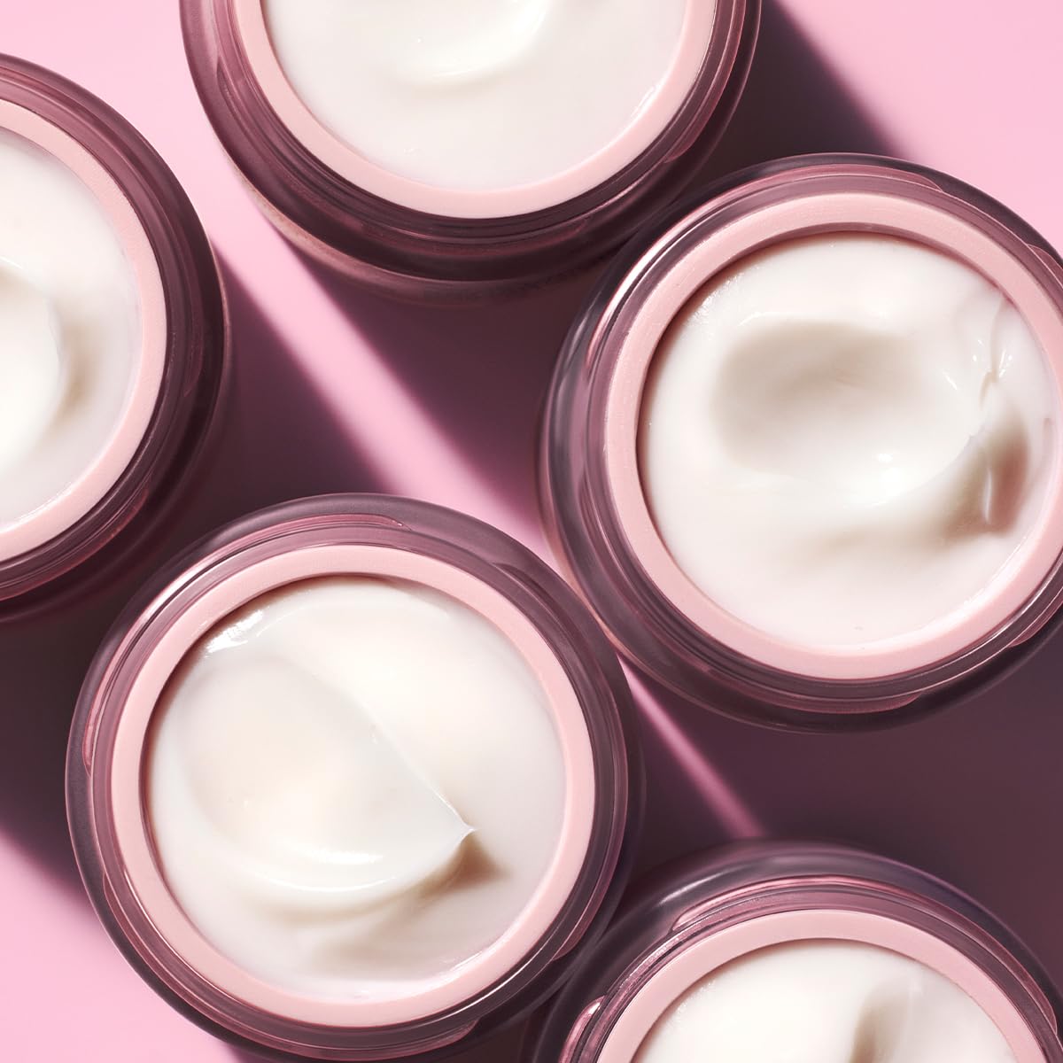 Caudalie Resveratrol Lift Firming Night Cream jars, 5 pink-lid containers with white cream on Tampa Home & Garden Store