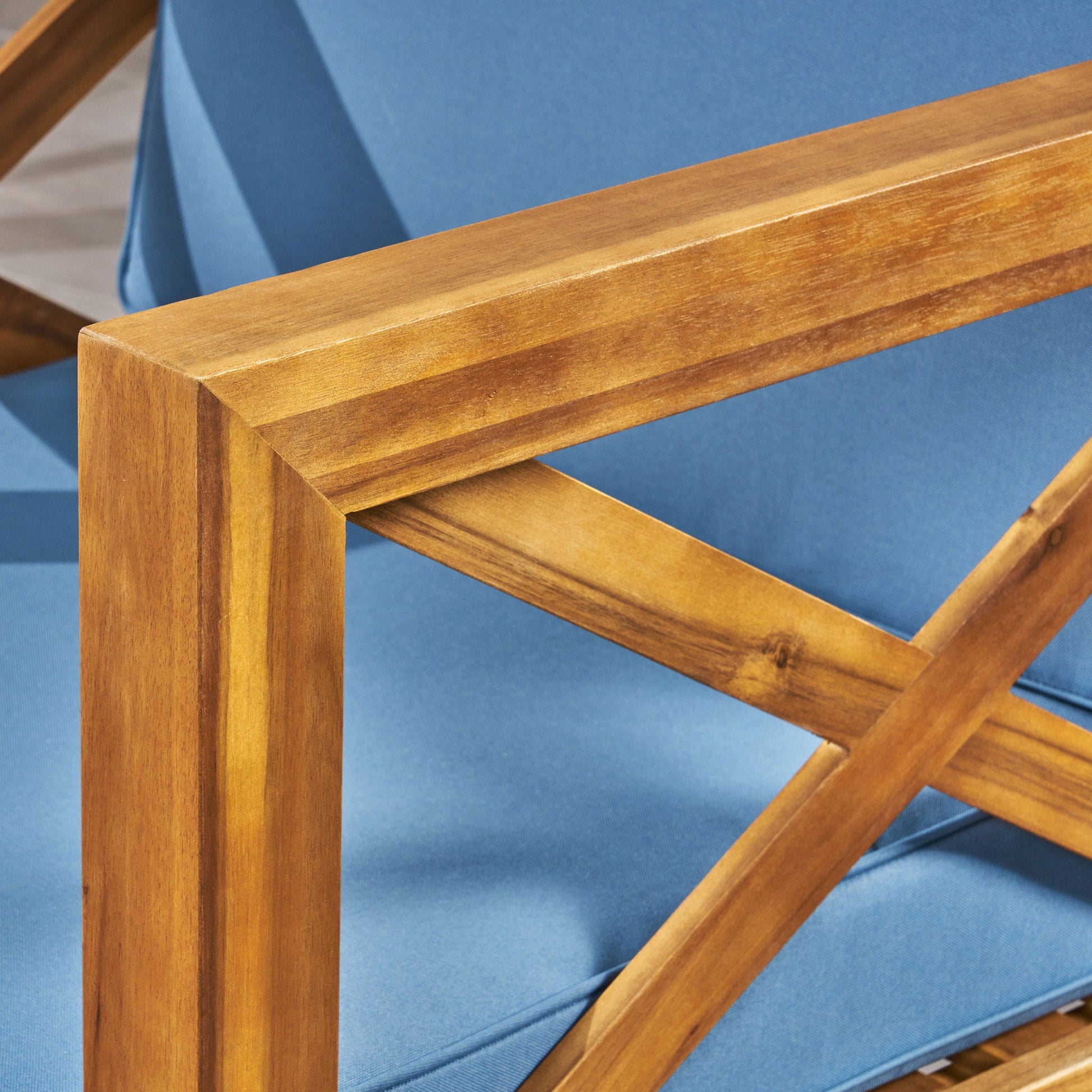 Brava Mid-Century Modern Club Chair with blue cushions and wooden frame for outdoor use on Tampa Home & Garden Store