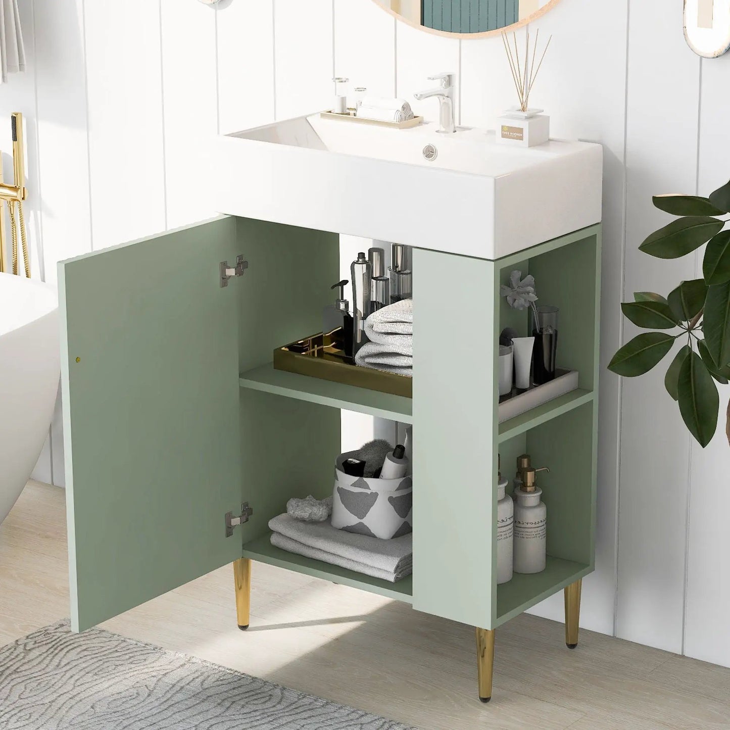 Bathroom vanity with white ceramic sink on a sage green cabinet with open shelf on Tampa Home & Garden Store