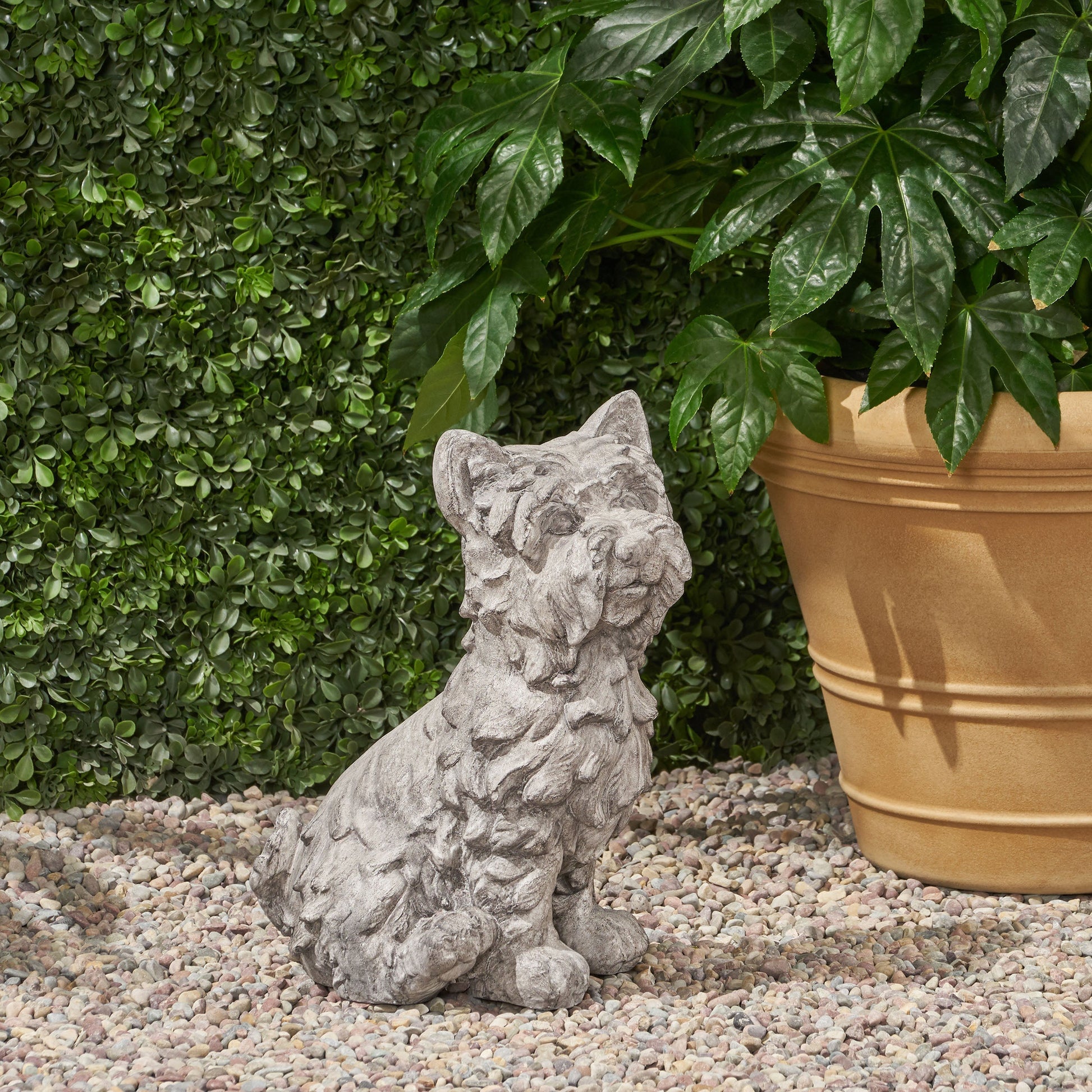 Cricket Dog Cast Stone Garden Statue by HouseOfZazla, gray stone garden statue among rocks on Tampa Home & Garden Store