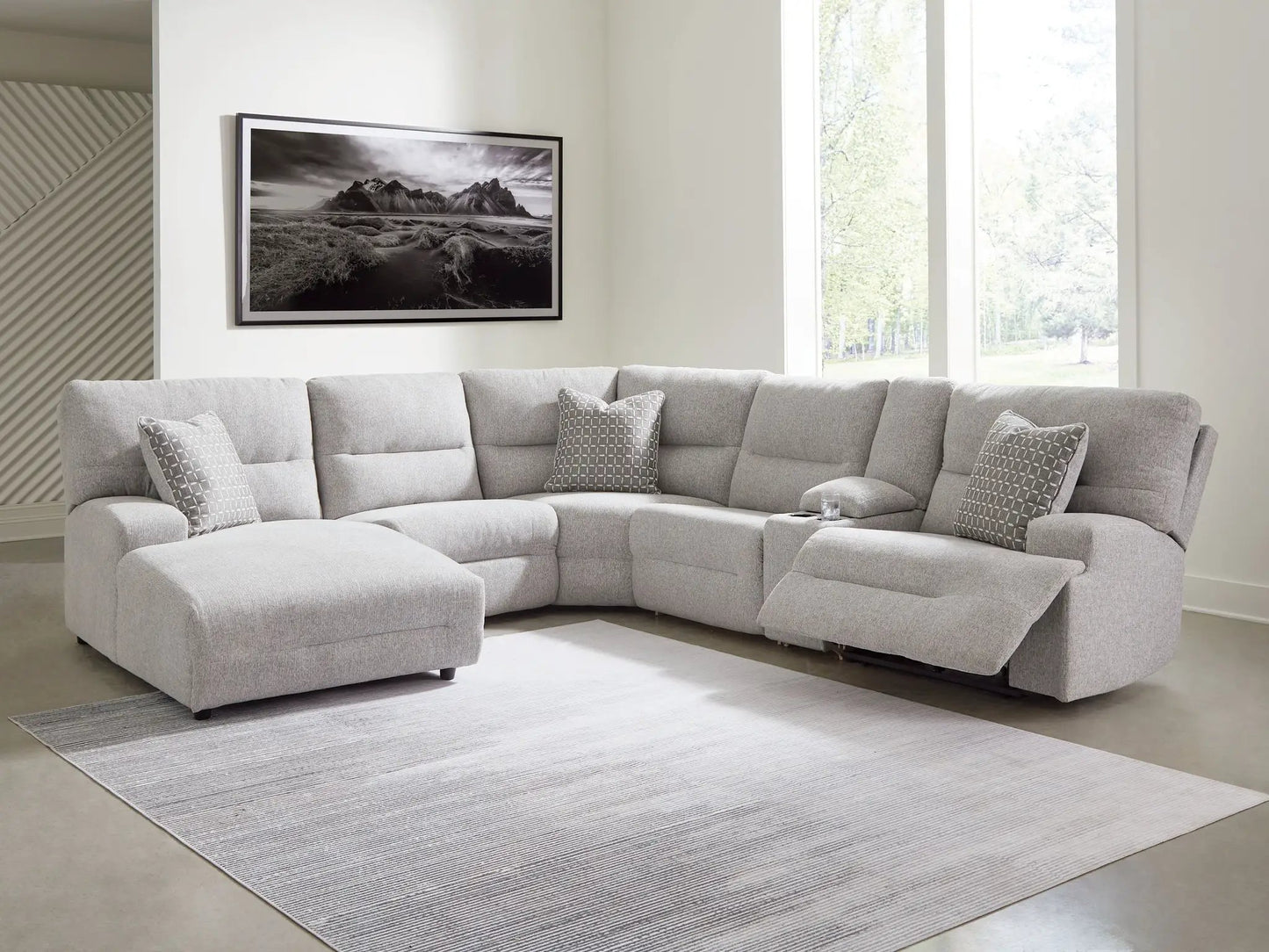 Acklen Place reclining sectional in gray fabric with pillows in a modern living room on Tampa Home & Garden Store