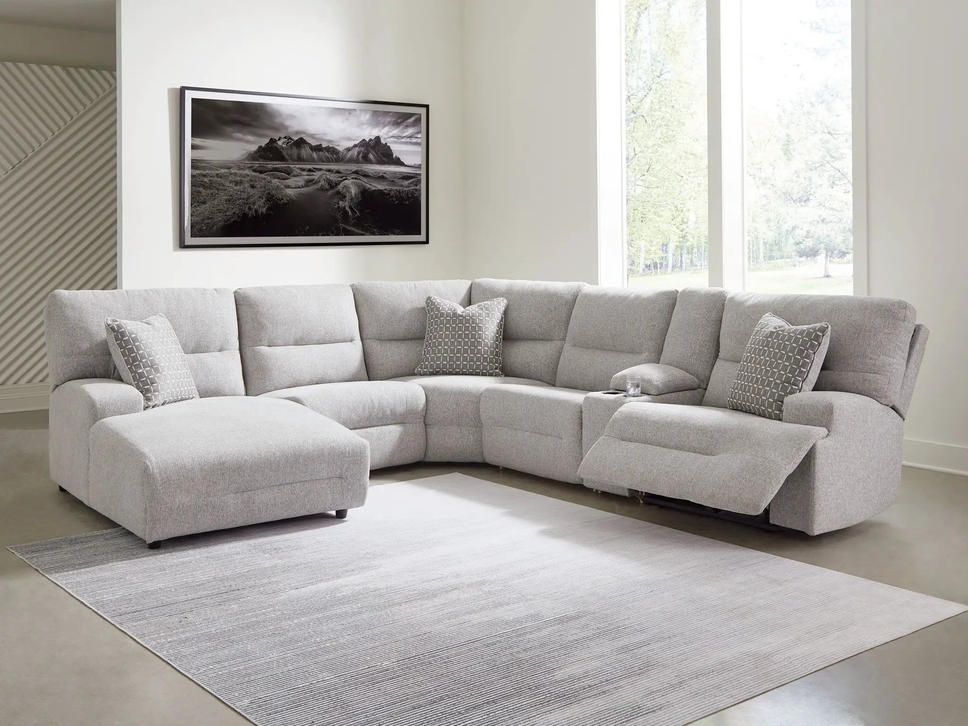 Acklen Place reclining sectional in gray fabric with pillows in a modern living room on Tampa Home & Garden Store