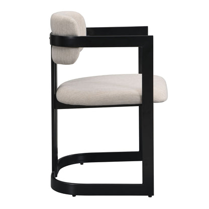 Upholstered dining armchair with beige fabric cushion and black metal frame on Tampa Home & Garden Store