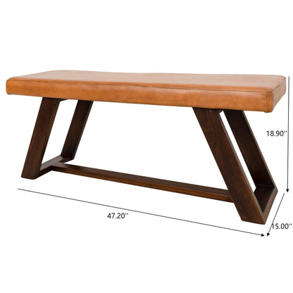 Light brown upholstered bench with hand stitching and dark wood angled legs on Tampa Home & Garden Store