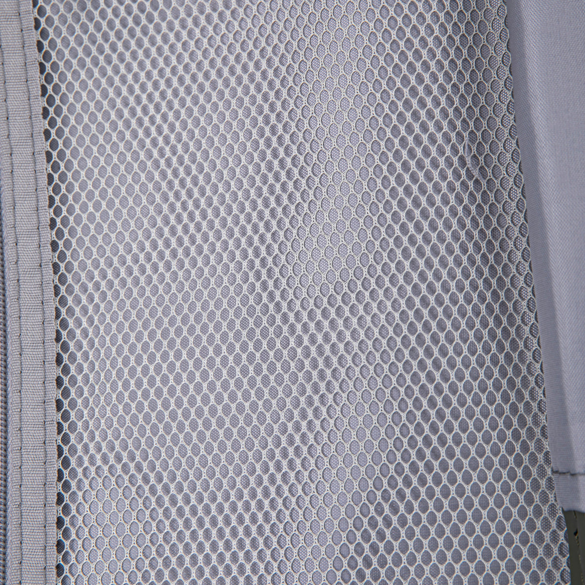Hard case luggage interior gray mesh fabric close-up with hexagonal pattern on Tampa Home & Garden Store