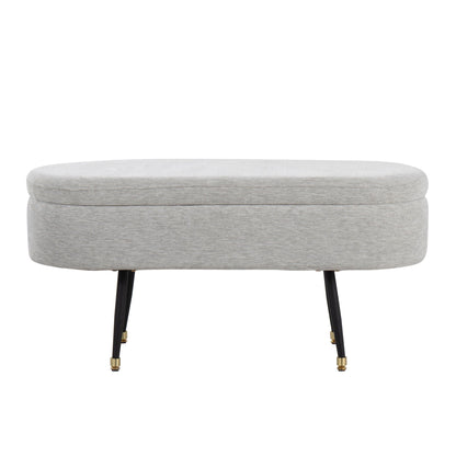 Contemporary storage bench ottoman in light gray fabric with black legs and brass foot caps on Tampa Home & Garden Store
