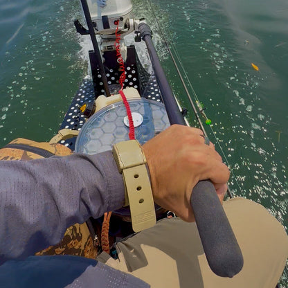 Kill Switch Wristband by Hoss Straps, beige safety strap with red coiled lanyard on watercraft on Tampa Home & Garden Store